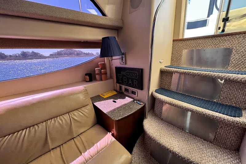 Slide: The Image of Interior of 2005 Meridian 368 Motoryacht with cozy seating and scenic window view. - 16