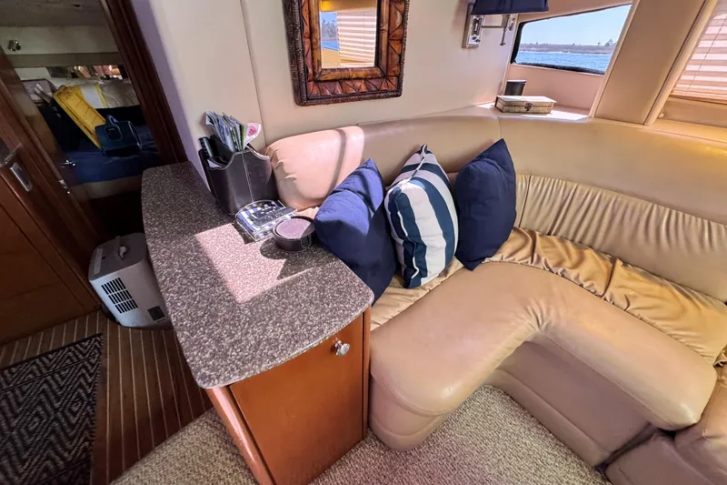 Slide: The Image of Interior of 2005 Meridian 368 Motoryacht with cozy seating and decorative pillows. - 19