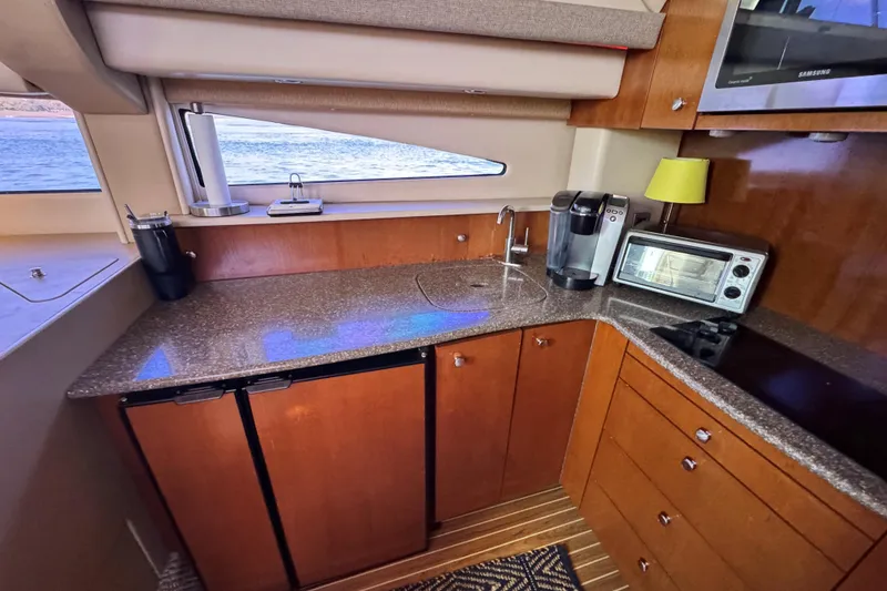 Slide: The Image of Luxurious 2005 Meridian 368 Motoryacht kitchen with modern appliances and sleek countertops. - 20