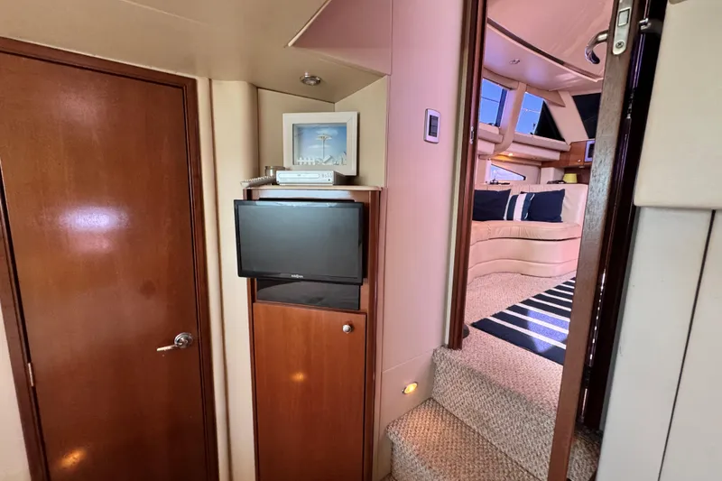 Slide: The Image of Interior of 2005 Meridian 368 Motoryacht with TV, stairs, and cozy seating area. - 31