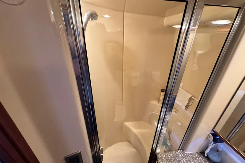 Slide: The Image of Shower area in 2005 Meridian 368 Motoryacht bathroom with glass door and modern fixtures. - 33