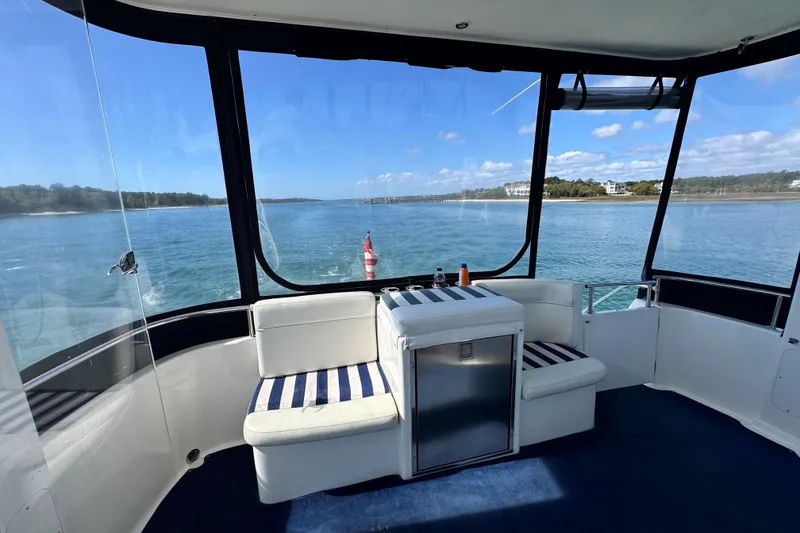 Slide: The Image of 2005 Meridian 368 Motoryacht interior with scenic water view and comfortable seating. - 35