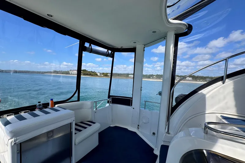 Slide: The Image of Interior view of 2005 Meridian 368 Motoryacht with ocean and coastline in background. - 36