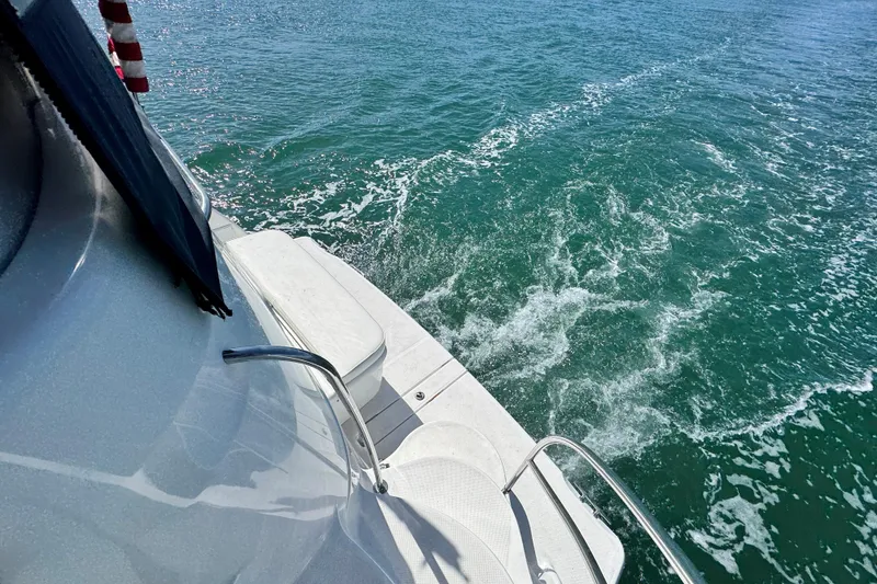 Slide: The Image of 2005 Meridian 368 Motoryacht cruising on clear blue water. - 37