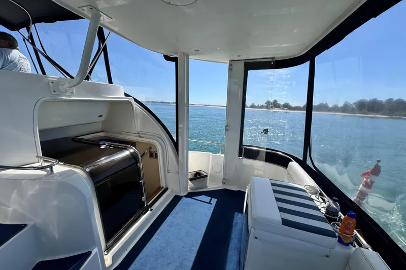Slide: The Image of 2005 Meridian 368 Motoryacht interior with ocean view and seating area. - 38
