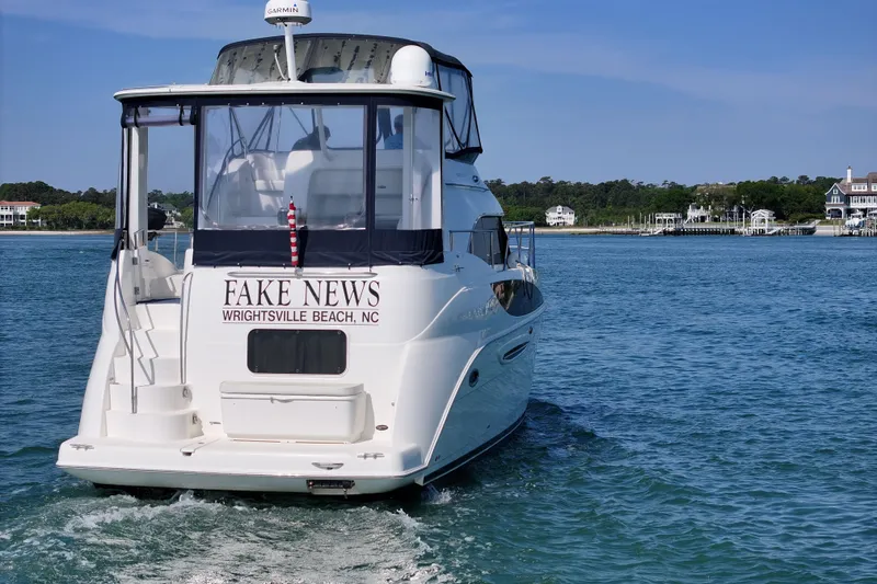 Slide: The Image of 2005 Meridian 368 Motoryacht named "Fake News" in Wrightsville Beach, NC waters. - 6