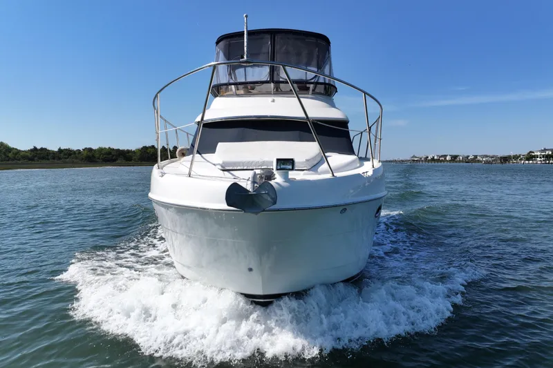 Slide: The Image of 2005 Meridian 368 Motoryacht cruising on a sunny day, front view. - 7