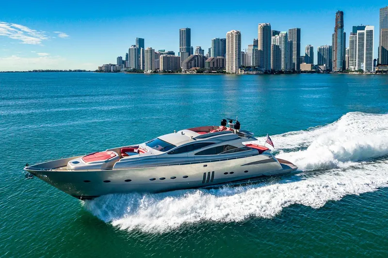 The Image of Luxury 2008 Pershing 90 yacht cruising near city skyline on a sunny day. - 0