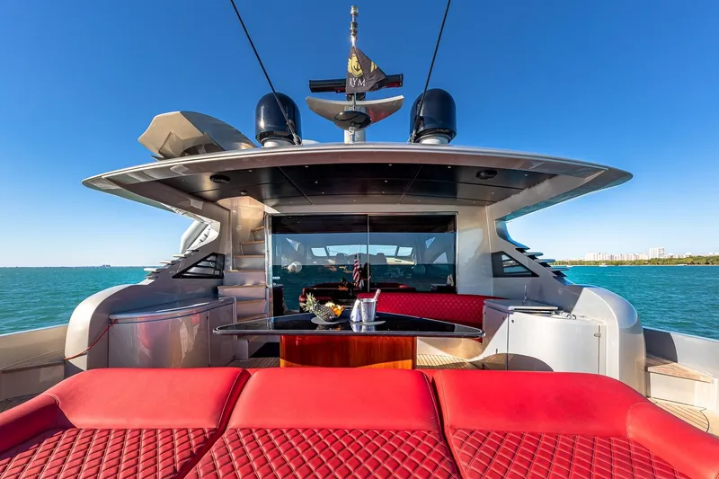 Slide: The Image of Luxurious 2008 Pershing 90 yacht with red seating, cruising on clear blue waters. - 16