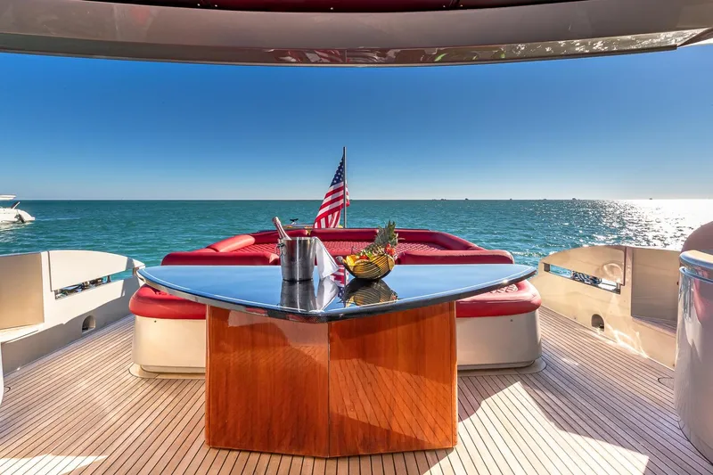 Slide: The Image of Luxurious 2008 Pershing 90 yacht deck with ocean view and American flag. - 17