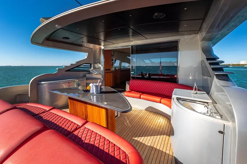 Slide: The Image of Luxurious 2008 Pershing 90 yacht deck with red seating and ocean view. - 18