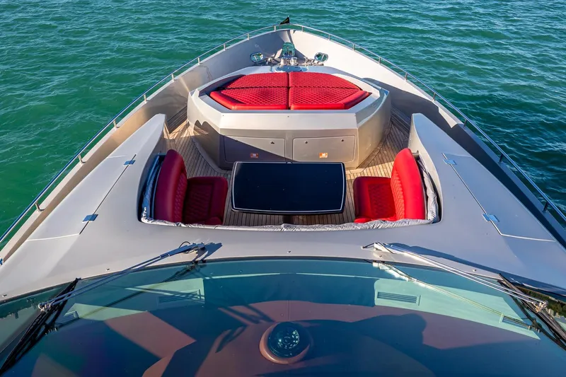 Slide: The Image of 2008 Pershing 90 yacht deck with red seating, cruising on blue water. - 22