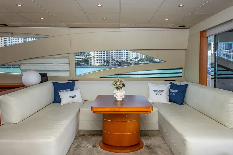 Slide: The Image of Luxurious interior of a 2008 Pershing 90 yacht with elegant seating and decorative pillows. - 27