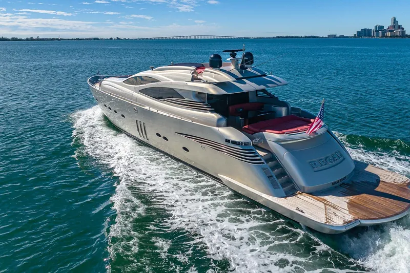 Slide: The Image of Luxurious 2008 Pershing 90 yacht cruising on open water, featuring sleek design and American flag. - 4
