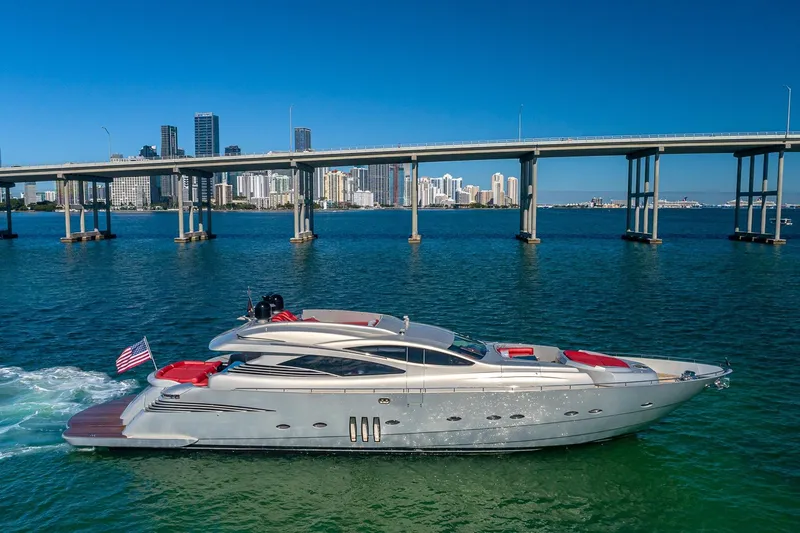 Slide: The Image of 2008 Pershing 90 yacht cruising near a city skyline and bridge on a sunny day. - 6