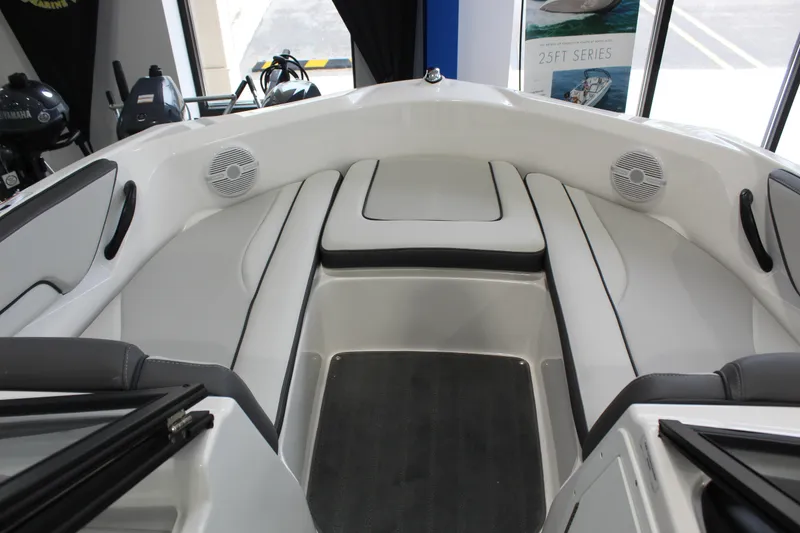 Slide: The Image of 2025 Yamaha Boats SX190 interior with cushioned seating and speakers. - 5