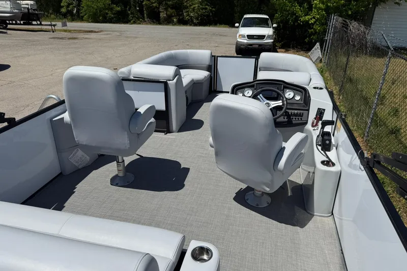 Slide: The Image of 2023 Bentley Pontoons 220 SWINGBACK interior with plush seating and modern dashboard. - 11