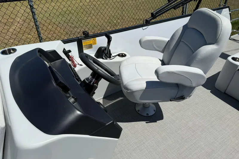 Slide: The Image of 2023 Bentley Pontoons 220 SWINGBACK helm with steering wheel and captain's chair. - 6