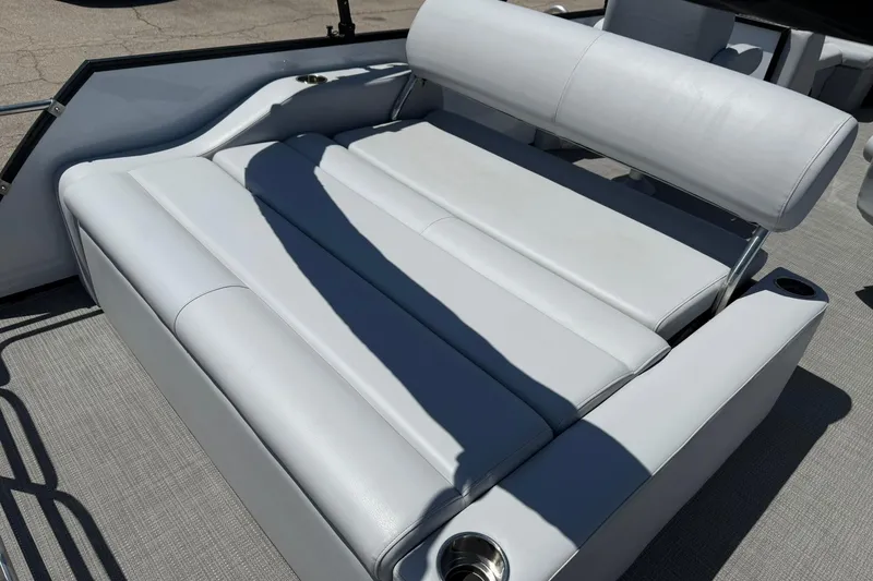 Slide: The Image of 2023 Bentley Pontoons 220 SWINGBACK with luxurious white seating and cup holders. - 9