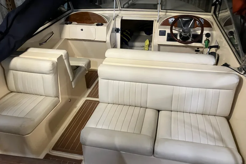Slide: The Image of Interior of a 2018 Rossiter 23 Classic Day Boat with cream seating and wooden accents. - 16