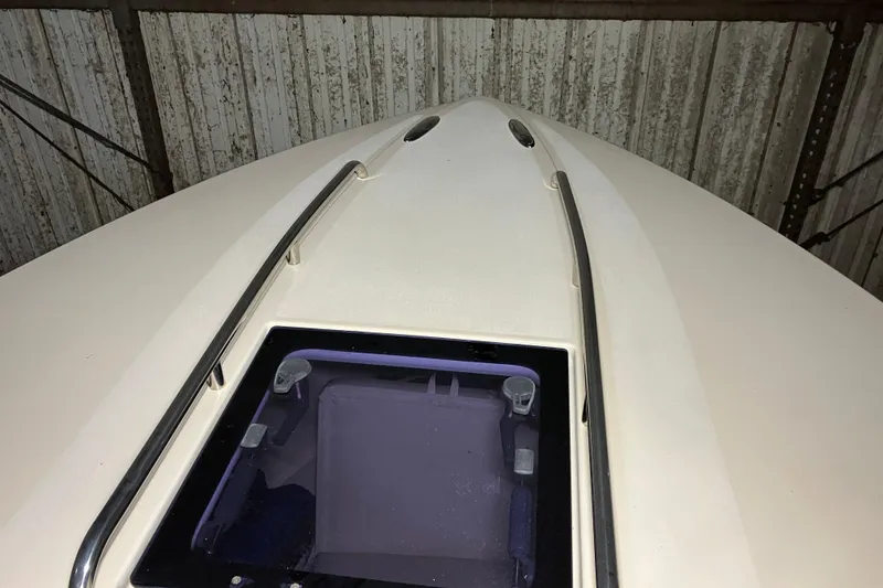 Slide: The Image of 2018 Rossiter 23 Classic Day Boat deck with hatch and railings in storage. - 20