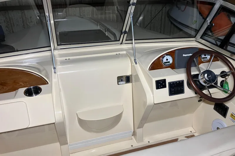 Slide: The Image of 2018 Rossiter 23 Classic Day Boat cockpit with steering wheel and instrument panel. - 21