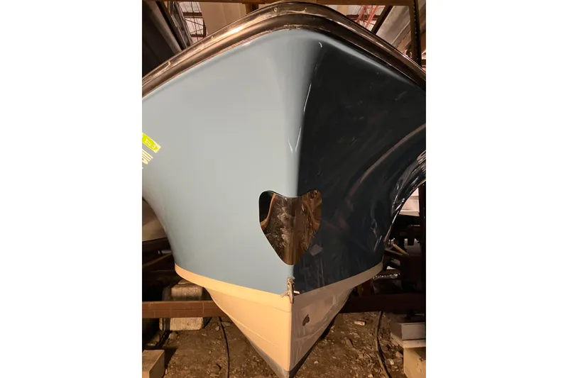 Slide: The Image of 2018 Rossiter 23 Classic Day Boat, blue hull, stored indoors. - 10