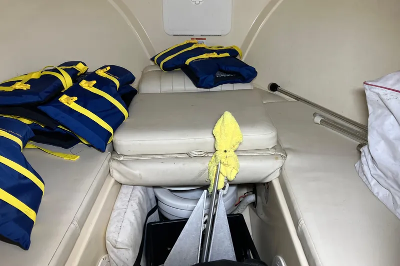 Slide: The Image of Interior of 2018 Rossiter 23 Classic Day Boat with life jackets and storage. - 22