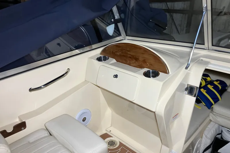 Slide: The Image of 2018 Rossiter 23 Classic Day Boat interior with seating and dashboard details. - 19