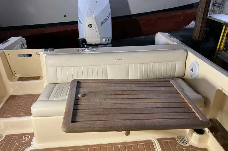 Slide: The Image of 2018 Rossiter 23 Classic Day Boat interior with seating and wooden table. - 14