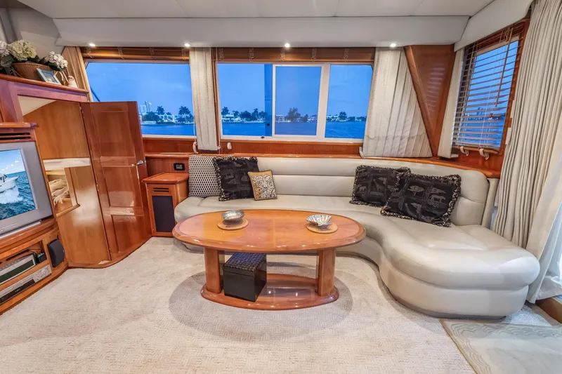 Slide: The Image of Luxurious 2003 Navigator Rival 5700 yacht interior with elegant seating and panoramic windows. - 39