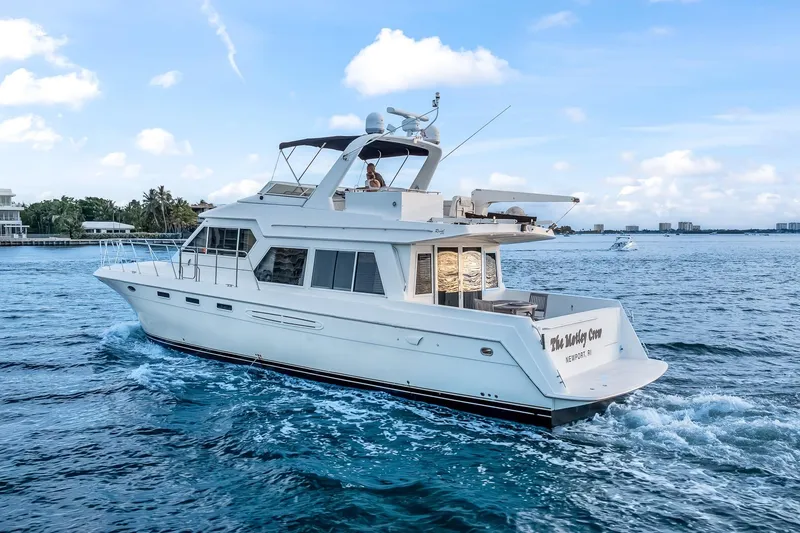 Slide: The Image of Luxury yacht Navigator Rival 5700 cruising on blue ocean waters, 2003 model. - 5