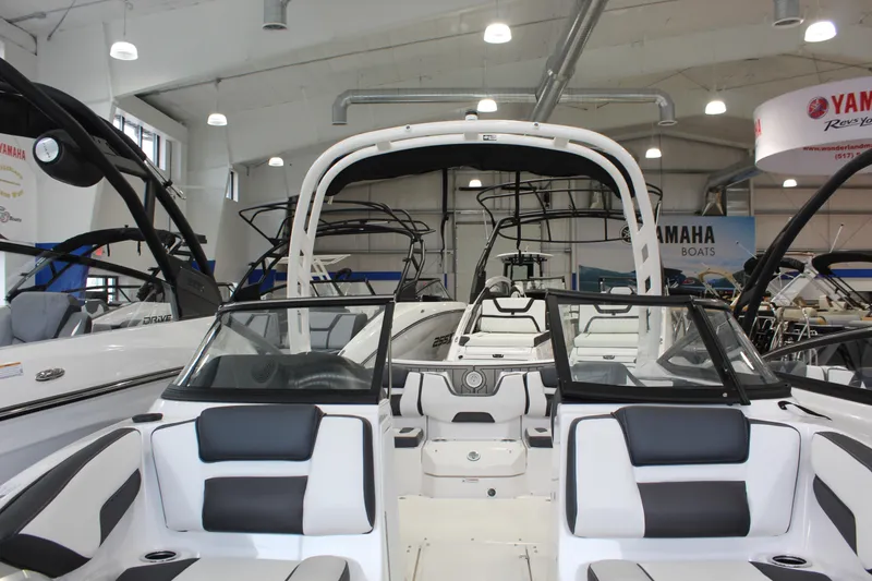 Slide: The Image of 2026 Yamaha Boats 195S displayed in a showroom, featuring sleek seating and modern design. - 2
