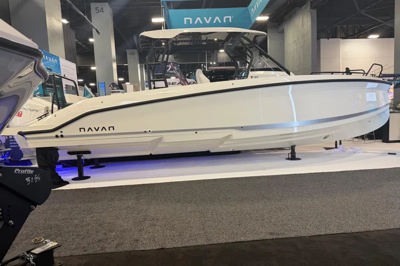 The Image of 2027 Navan T30 boat displayed at an indoor exhibition, showcasing sleek design and modern features. - 1