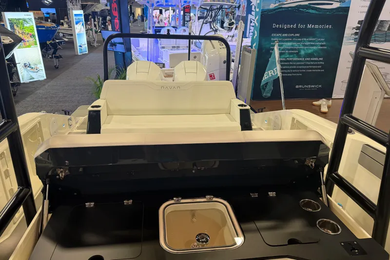 Slide: The Image of 2027 Navan T30 boat interior at a marine exhibition, showcasing seating and amenities. - 10