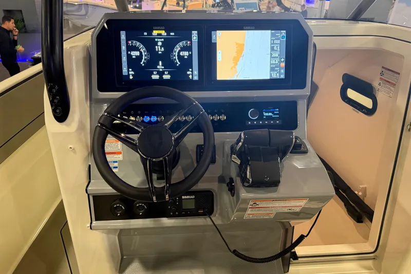 Slide: The Image of Cockpit of 2027 Navan T30 boat with advanced navigation display and controls. - 12