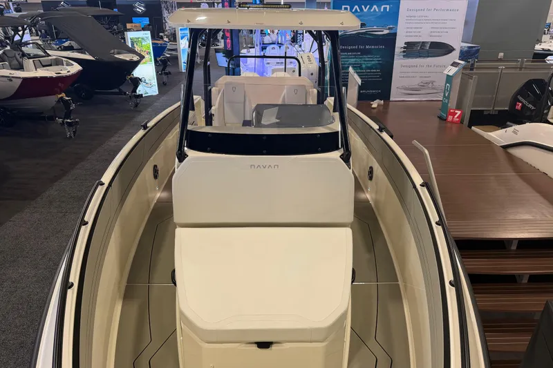 Slide: The Image of 2027 Navan T30 boat displayed at an indoor exhibition, showcasing sleek design and modern features. - 15