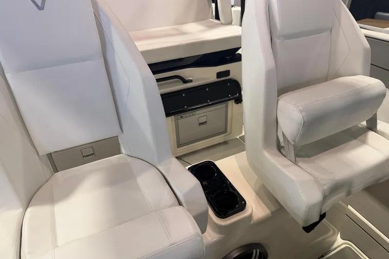 Slide: The Image of Luxurious white seating in 2027 Navan T30 boat interior with cup holders. - 19