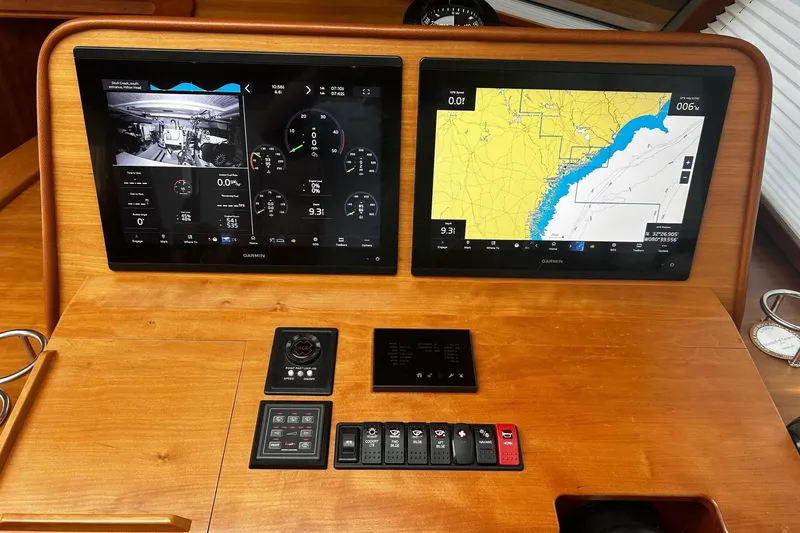 Slide: The Image of Luxurious bathroom in 2021 Sabre 45 Salon Express yacht, featuring elegant wood cabinetry and modern fixtures. - 11