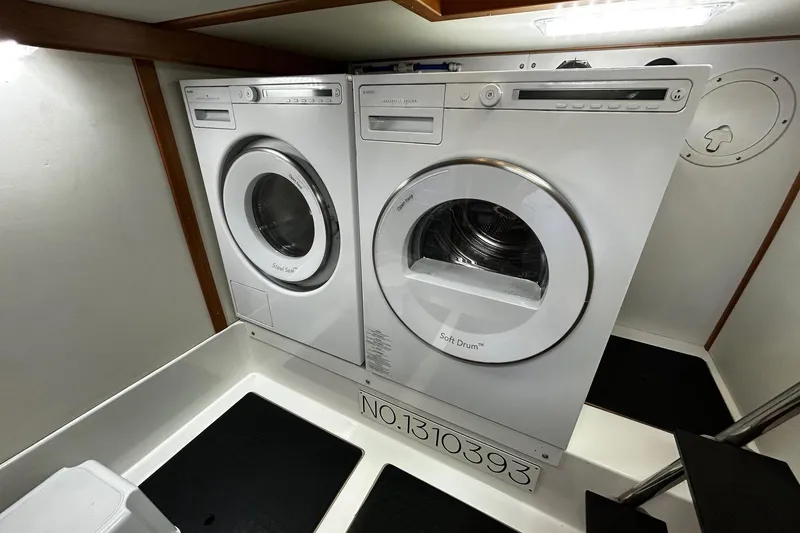 Slide: The Image of Interior of 2021 Sabre 45 Salon Express yacht, featuring elegant wood cabinetry and modern appliances. - 14