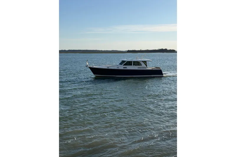 Slide: The Image of 2021 Sabre 45 Salon Express cruising on calm waters under a clear sky. - 36
