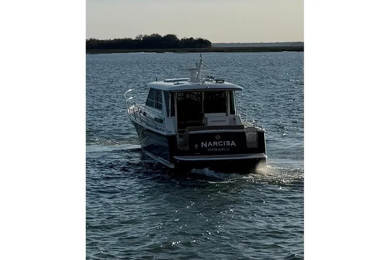 Slide: The Image of 2021 Sabre 45 Salon Express yacht cruising on open water. - 37