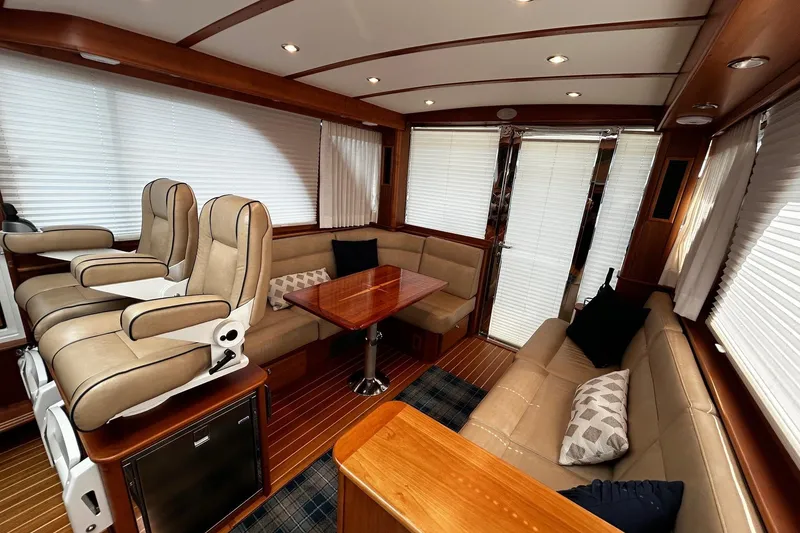 Slide: The Image of 2021 Sabre 45 Salon Express yacht docked in a serene marina setting. - 8