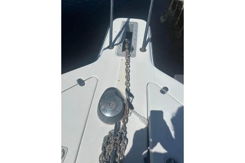 Slide: The Image of Bow of 2000 Shamrock 290 Walkaround boat with anchor chain and winch. - 15