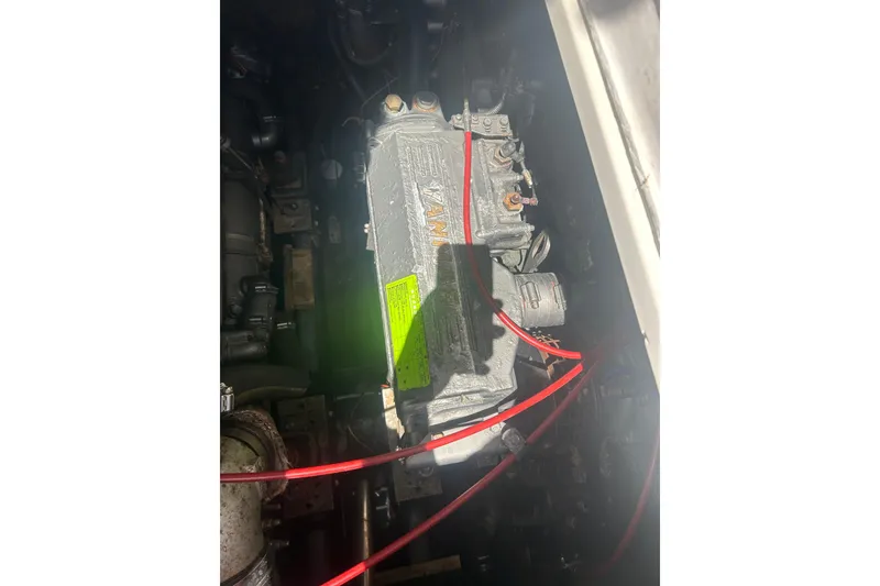 Slide: The Image of Engine compartment of a 2000 Shamrock 290 Walkaround boat with visible wiring. - 24