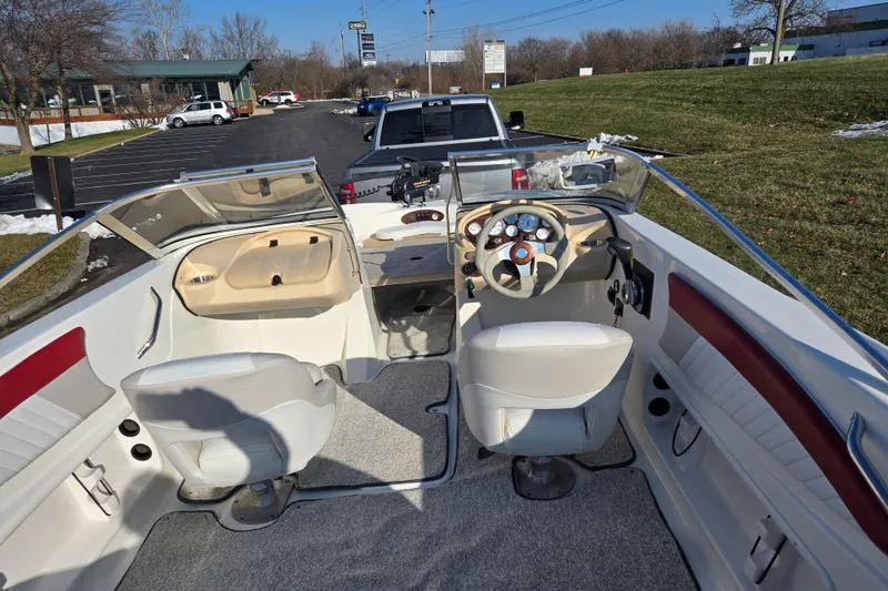 Slide: The Image of 2007 Glastron GT 205 Ski & Fish boat interior with steering wheel and seating. - 11