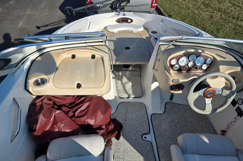 Slide: The Image of 2007 Glastron GT 205 Ski & Fish boat interior with dashboard and seating. - 12