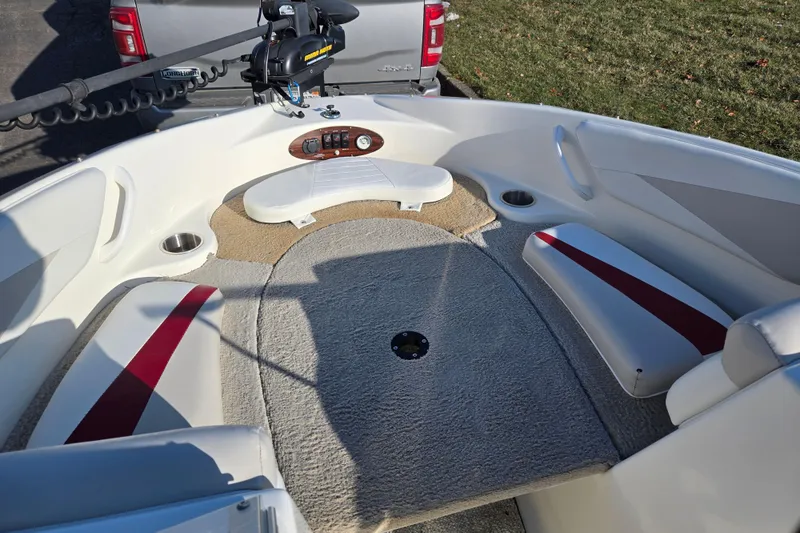 Slide: The Image of 2007 Glastron GT 205 Ski & Fish boat interior with seating and trolling motor. - 18