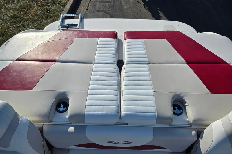 Slide: The Image of 2007 Glastron GT 205 Ski & Fish boat with red and white seating. - 23