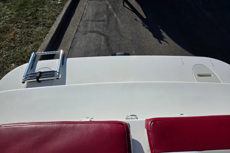 Slide: The Image of 2007 Glastron GT 205 Ski & Fish boat with red seats and swim platform ladder. - 26